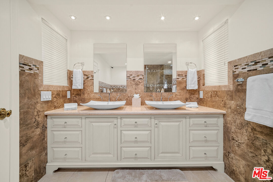 11875 Pradera Road Santa Rosa Valley, CA 93012 - Photo 28 of 35 a bathroom with a double vanity sink and a mirror