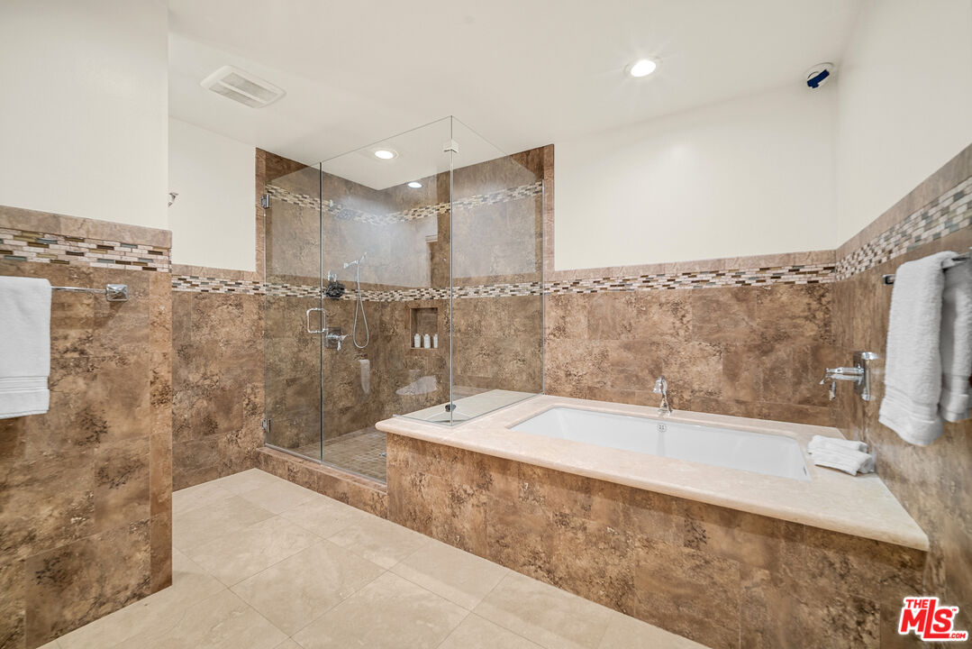 11875 Pradera Road Santa Rosa Valley, CA 93012 - Photo 29 of 35 a bathroom with a bathtub and a shower