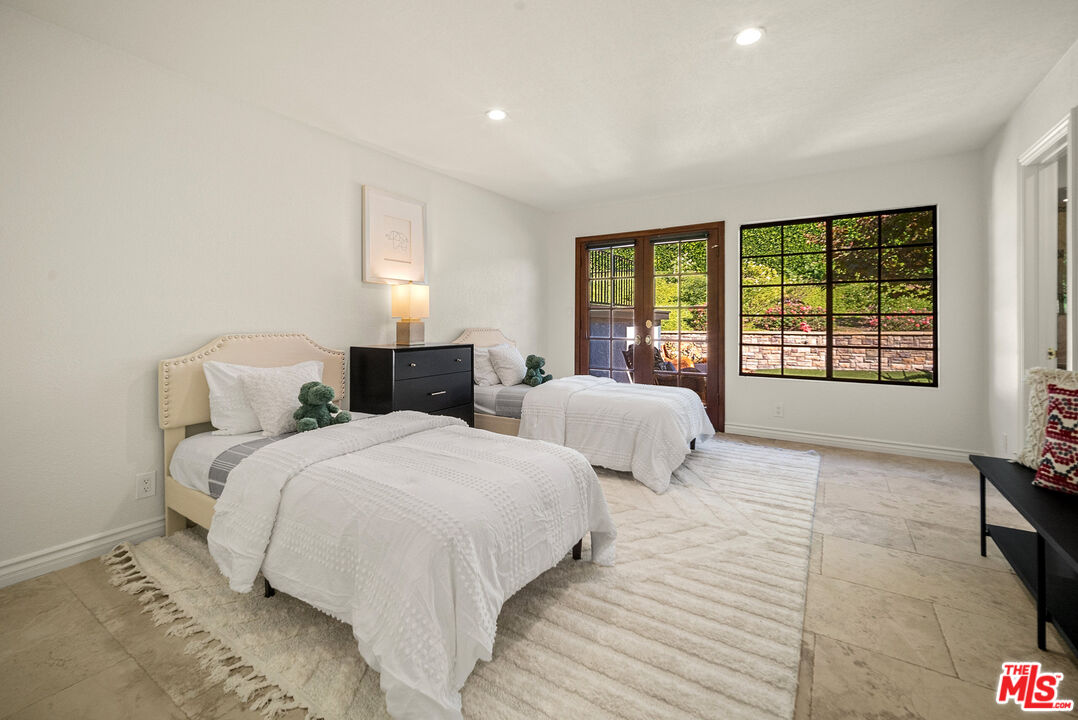 11875 Pradera Road Santa Rosa Valley, CA 93012 - Photo 30 of 35 a bedroom with two beds and a large window