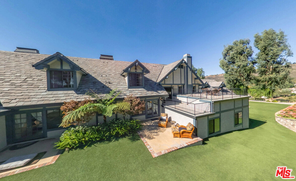 11875 Pradera Road Santa Rosa Valley, CA 93012 - Photo 33 of 35 a view of a house with a garden and deck