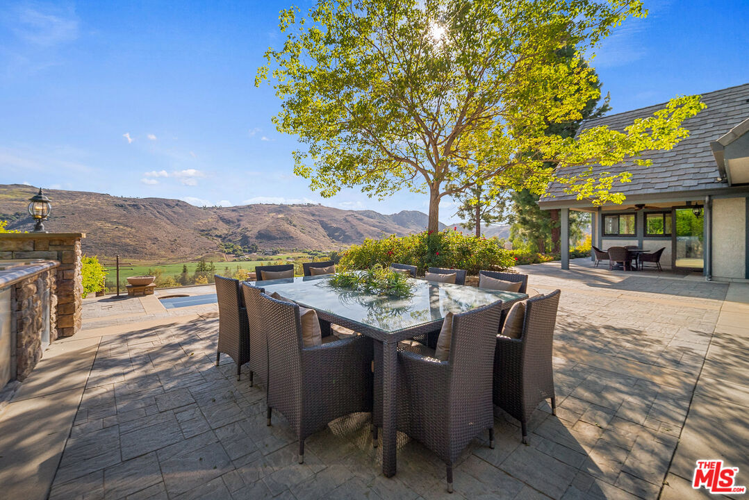 11875 Pradera Road Santa Rosa Valley, CA 93012 - Photo 34 of 35 a view of a patio with furniture and a yard