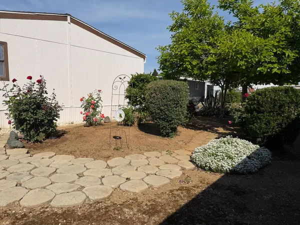 a view of a backyard of the house