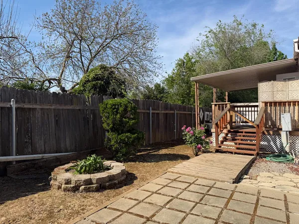 a view of a backyard with a patio