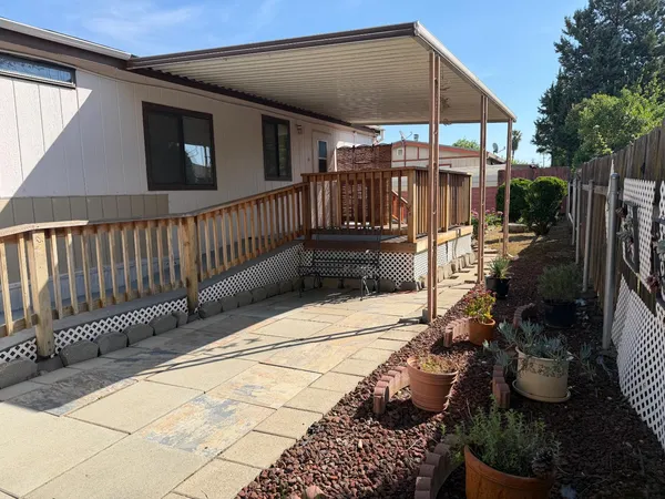a view of a chairs and tables in the patio