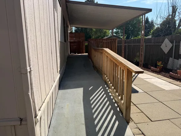 a view of balcony with wooden floor