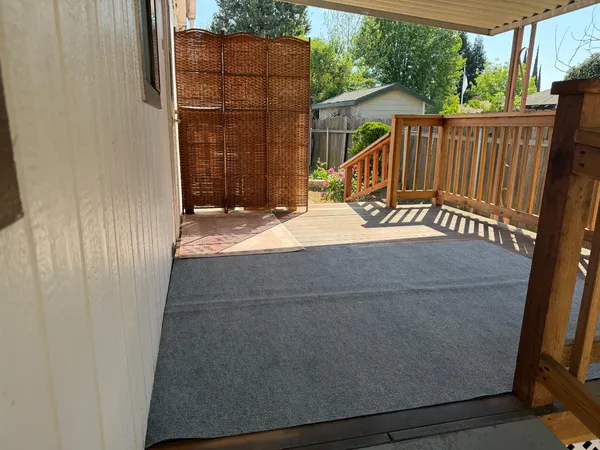 a view of balcony with wooden floor