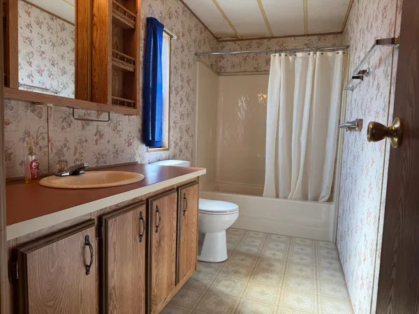 a bedroom with a bed and a table