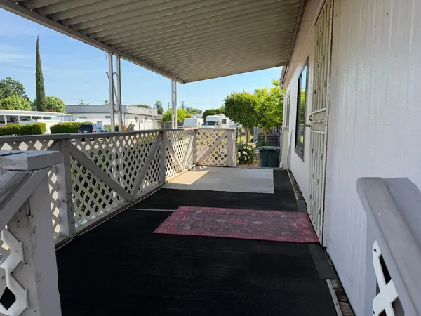 a view of a balcony with furniture