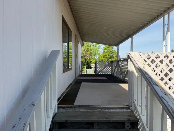 a view of balcony with wooden floor