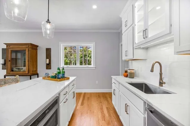 a kitchen that has a lot of cabinets in it