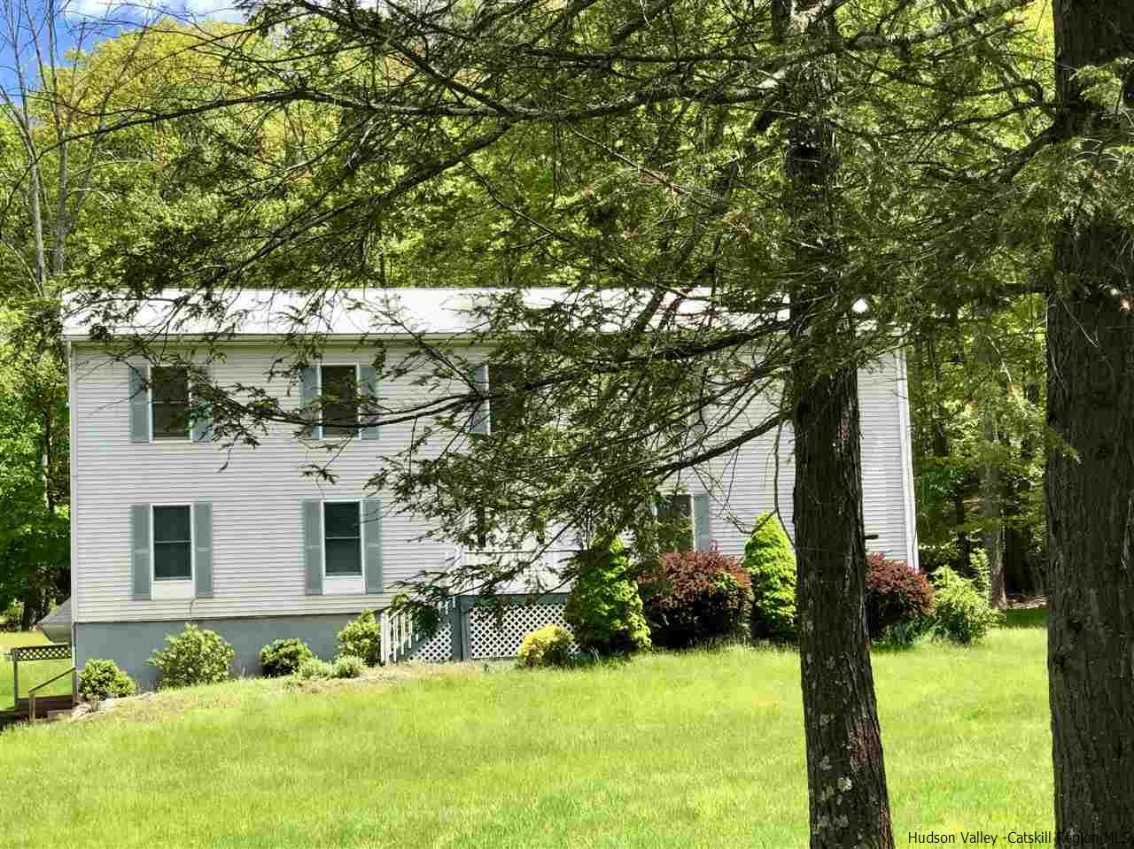 190 Buck Road Stone Ridge, NY 12484 - Photo 1 of 33 a view of backyard with a garden and trees