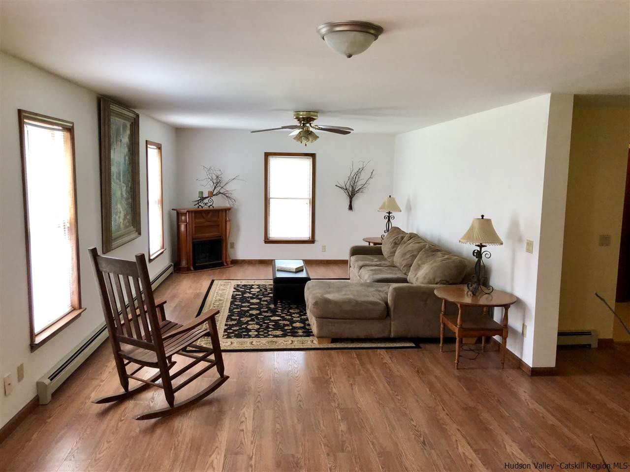 190 Buck Road Stone Ridge, NY 12484 - Photo 4 of 33 a living room with furniture and a wooden floor