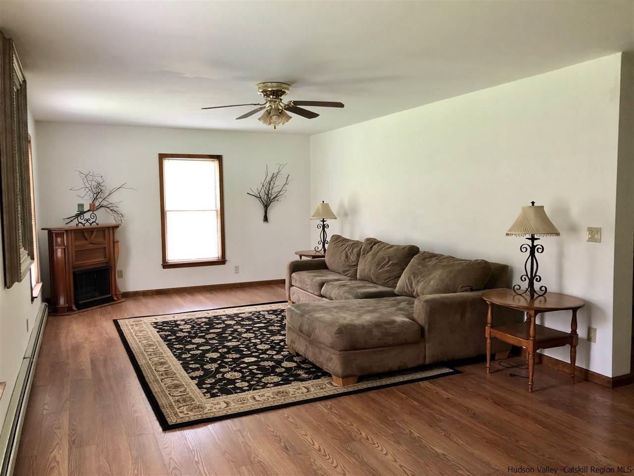 190 Buck Road Stone Ridge, NY 12484 - Photo 5 of 33 a living room with furniture and a rug