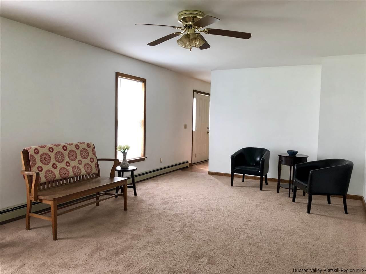 190 Buck Road Stone Ridge, NY 12484 - Photo 9 of 33 a living room with furniture and a window
