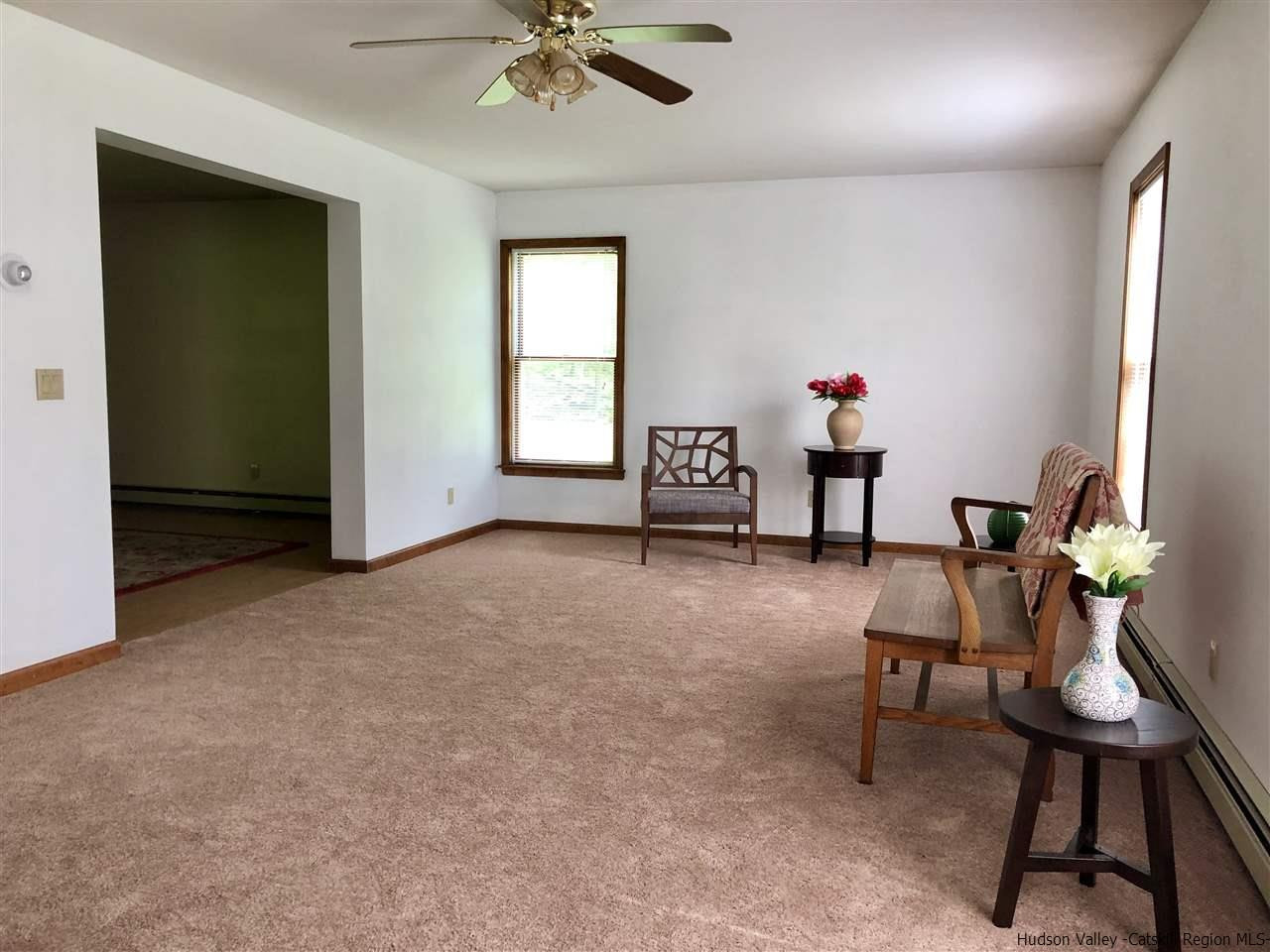 190 Buck Road Stone Ridge, NY 12484 - Photo 10 of 33 a living room with furniture and a window