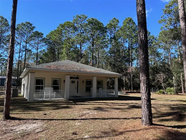 a house with trees in the background