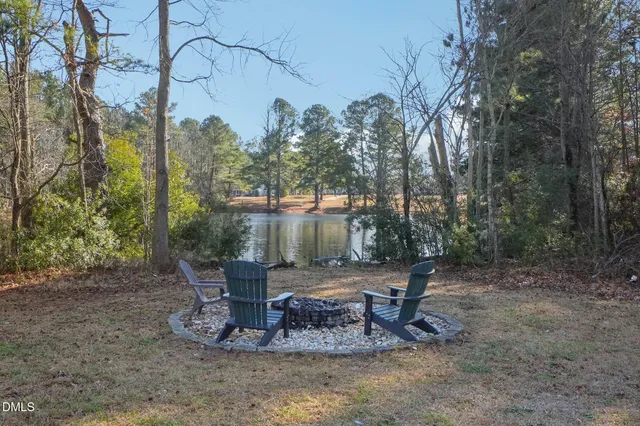 a view of a swimming pool with a yard