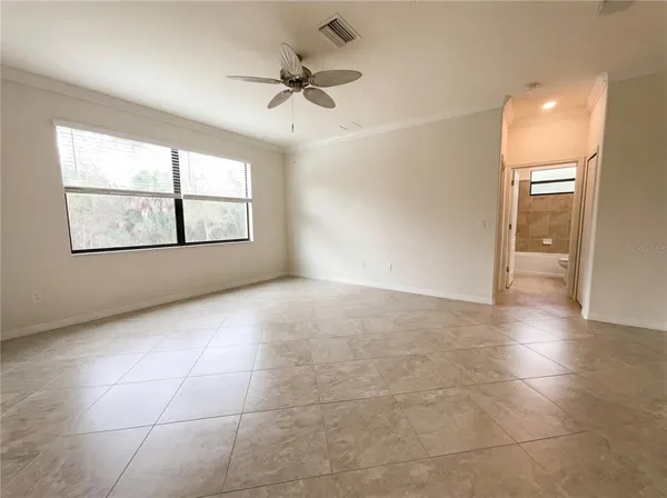 a view of an empty room with a window