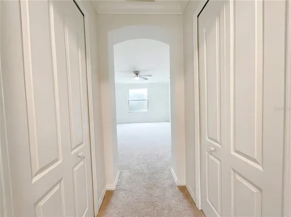a view of a hallway with a door