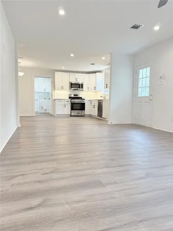 a view of kitchen and kitchen with sink