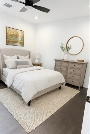 an empty room with a bathroom and a shower