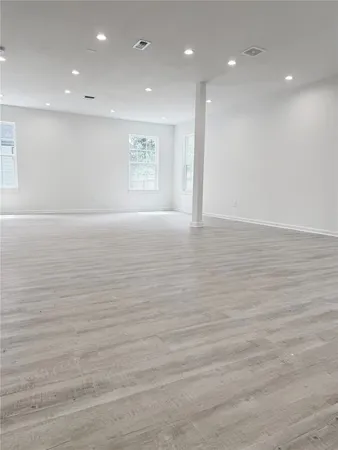 an empty room with an empty space and window
