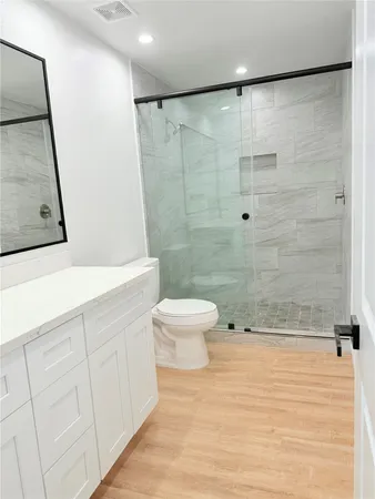 a view of cabinets with wooden floor