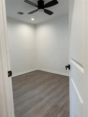 a view of balcony with wooden floor