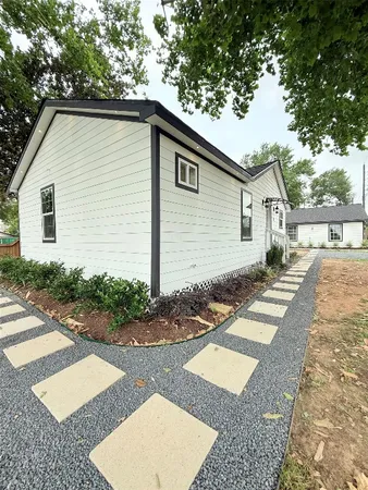 a house view with a backyard space