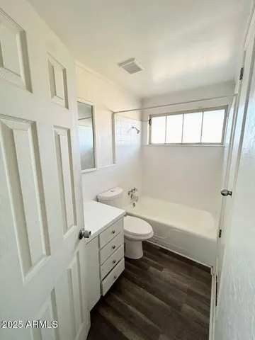 a bathroom with a bathtub sink toilet and a bathtub