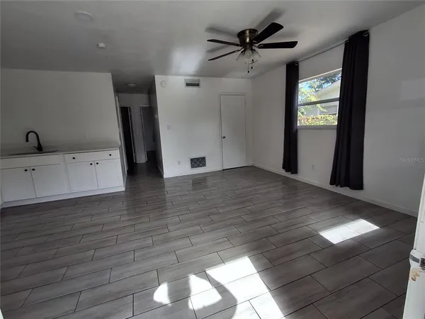 a view of a livingroom with wooden floor