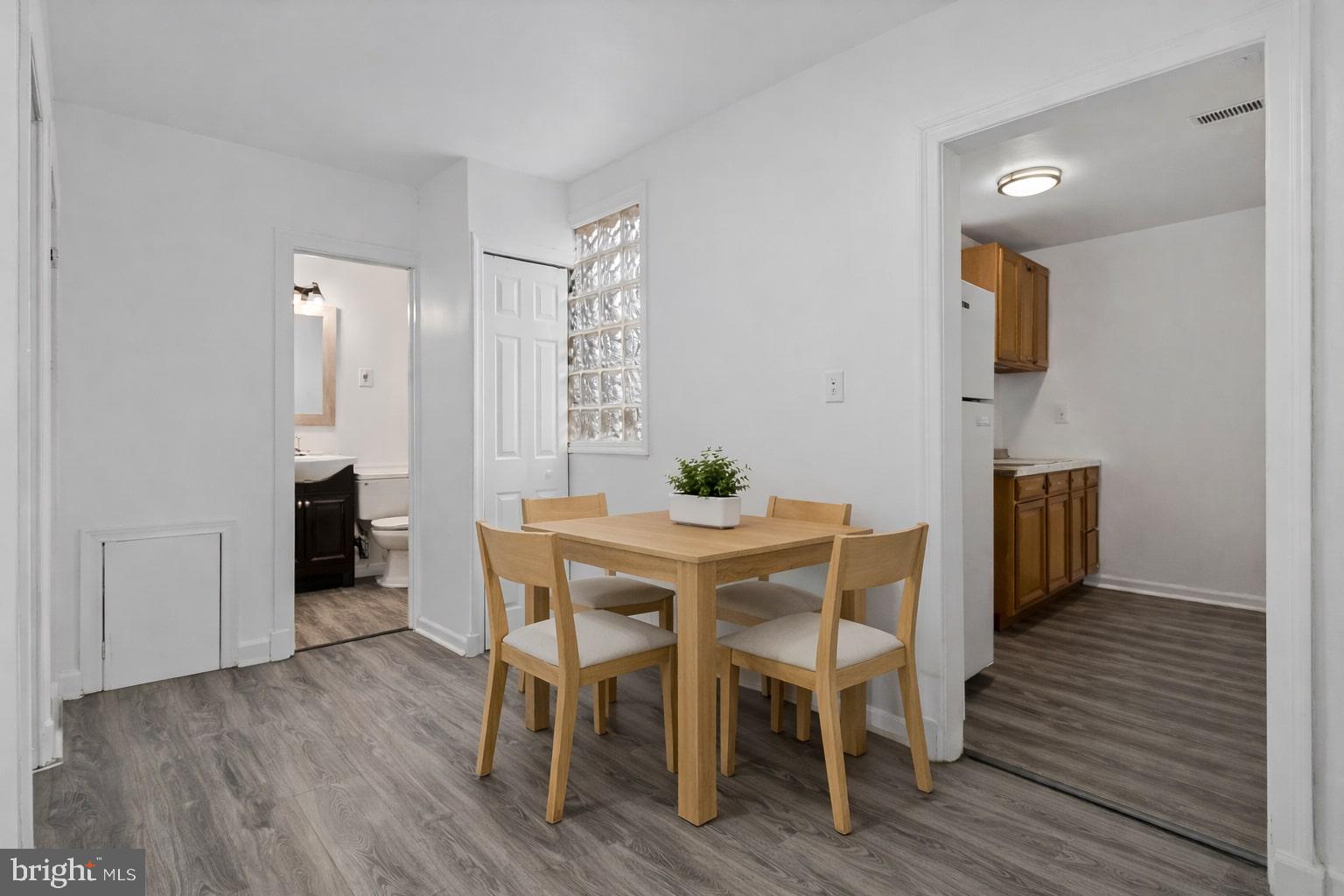 4834-4836 Sheriff Road Northeast Washington, DC 20019 - Photo 12 of 18 a dining room with furniture and wooden floor