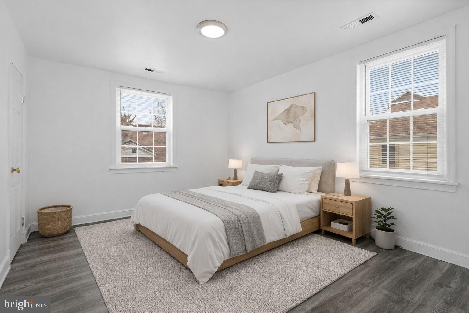 4834-4836 Sheriff Road Northeast Washington, DC 20019 - Photo 14 of 18 a bedroom with a bed and a window