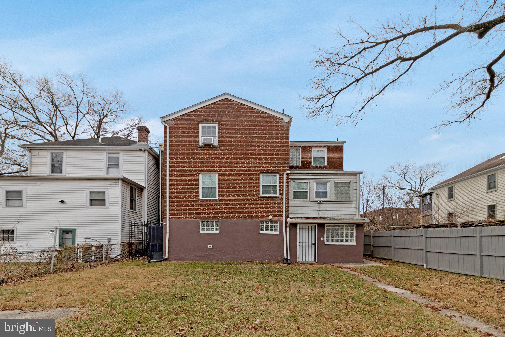4834-4836 Sheriff Road Northeast Washington, DC 20019 - Photo 17 of 18 a front view of a house with a yard