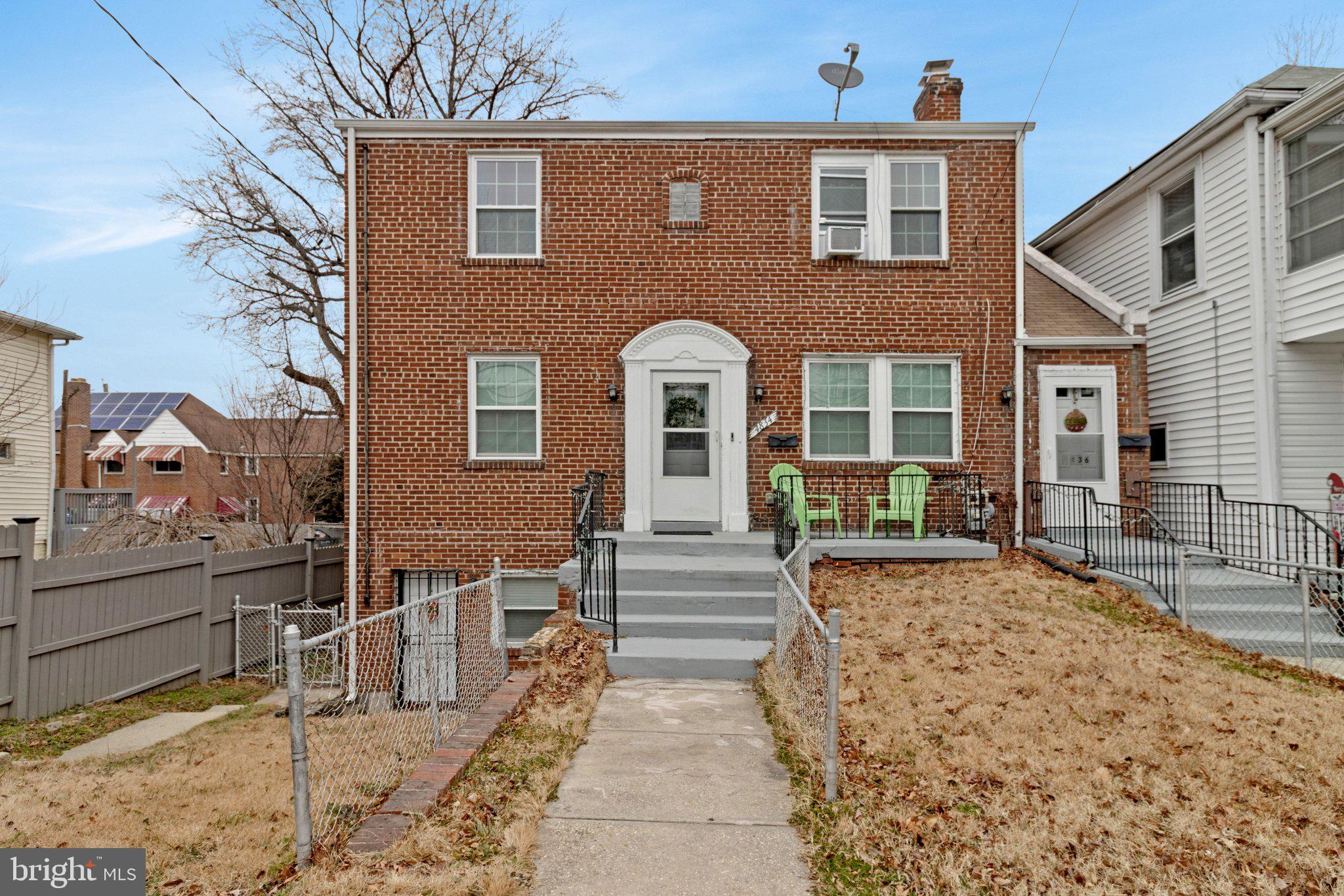 4834-4836 Sheriff Road Northeast Washington, DC 20019 - Photo 18 of 18 a front view of a house with a garden