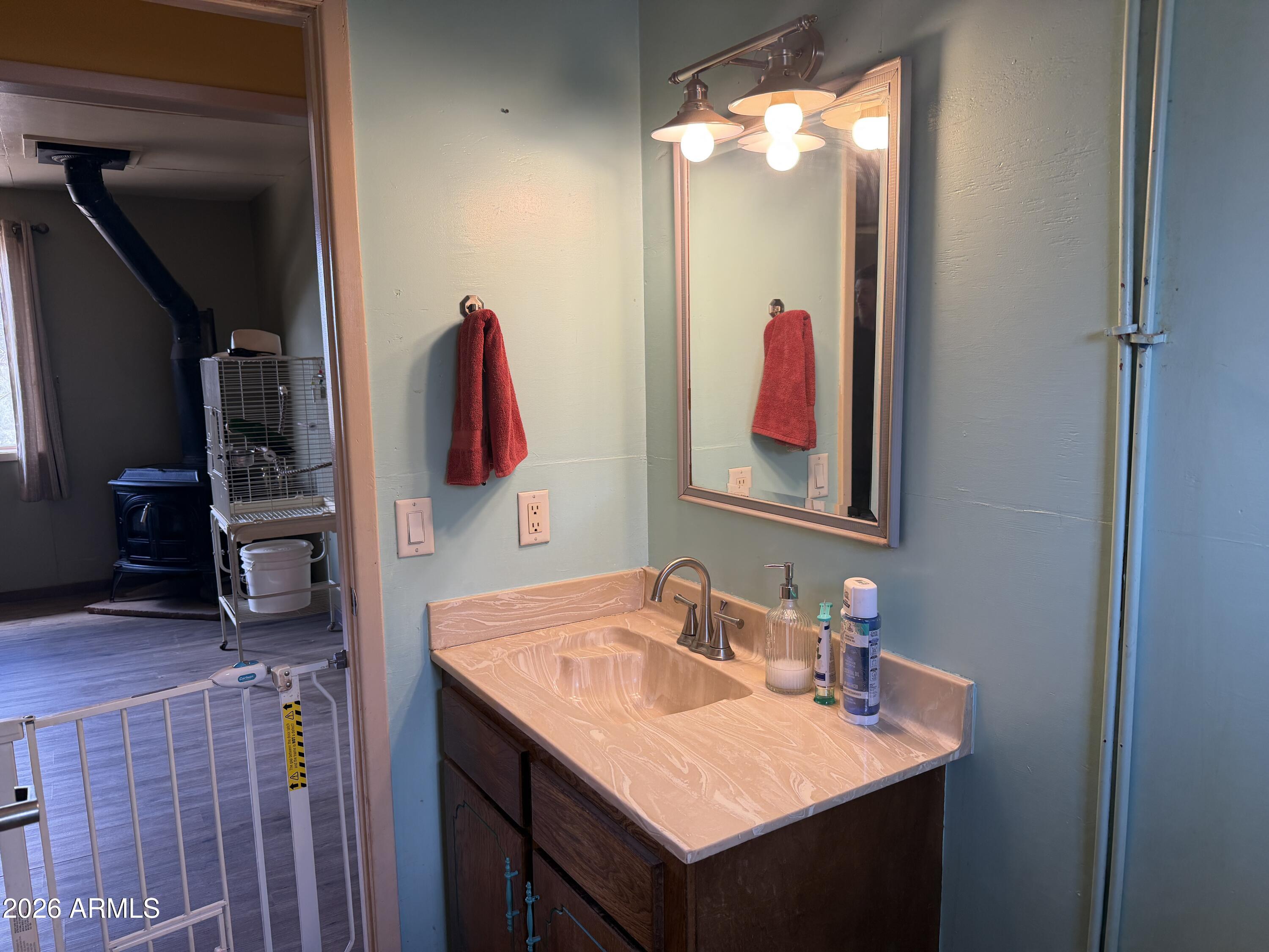 1 Hideaway Road Ash Fork, AZ 86320 - Photo 10 of 43 a bathroom with a sink vanity and a mirror