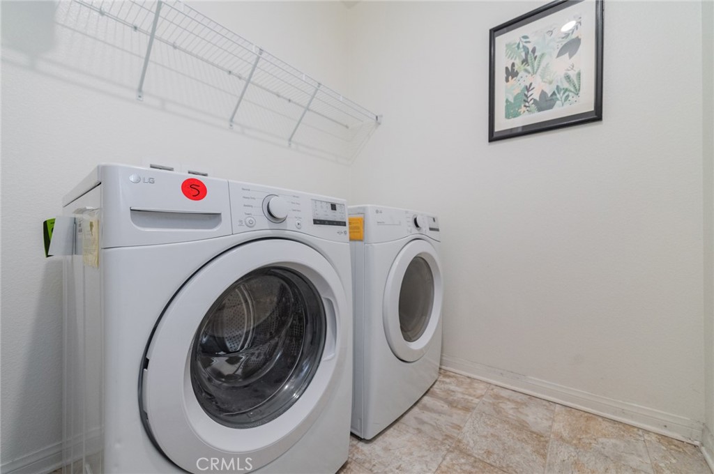 7309 Grazing Lane Riverside, CA 92507 - Photo 17 of 43 a utility room with dryer and washer