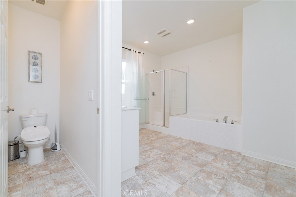 7309 Grazing Lane Riverside, CA 92507 - Photo 31 of 43 a bathroom with a toilet sink and shower