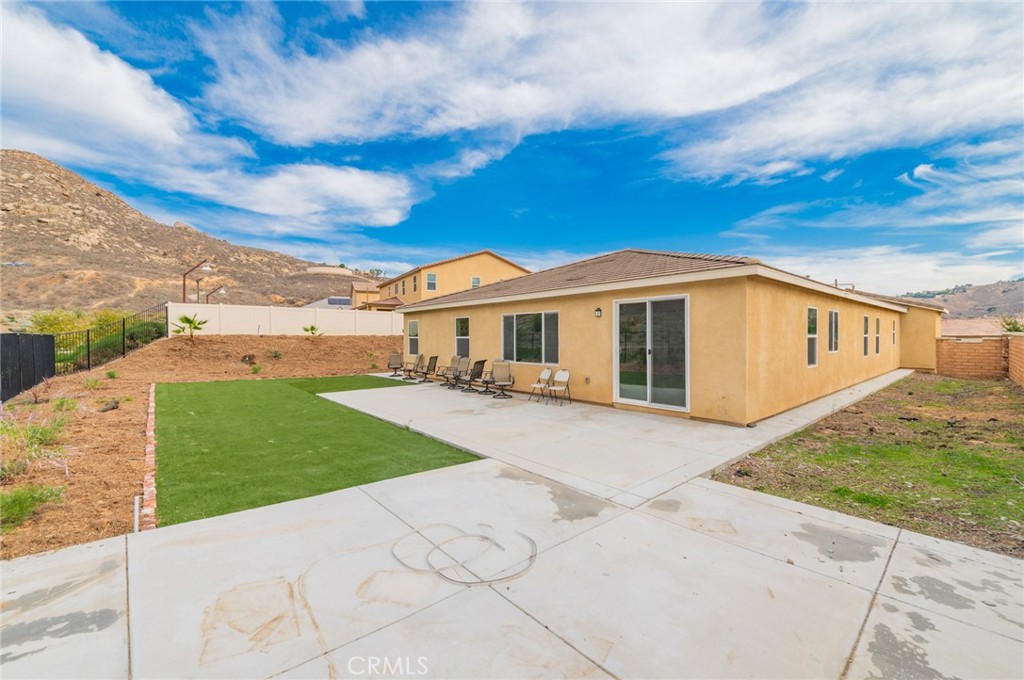 7309 Grazing Lane Riverside, CA 92507 - Photo 38 of 43 a front view of a house with a garden
