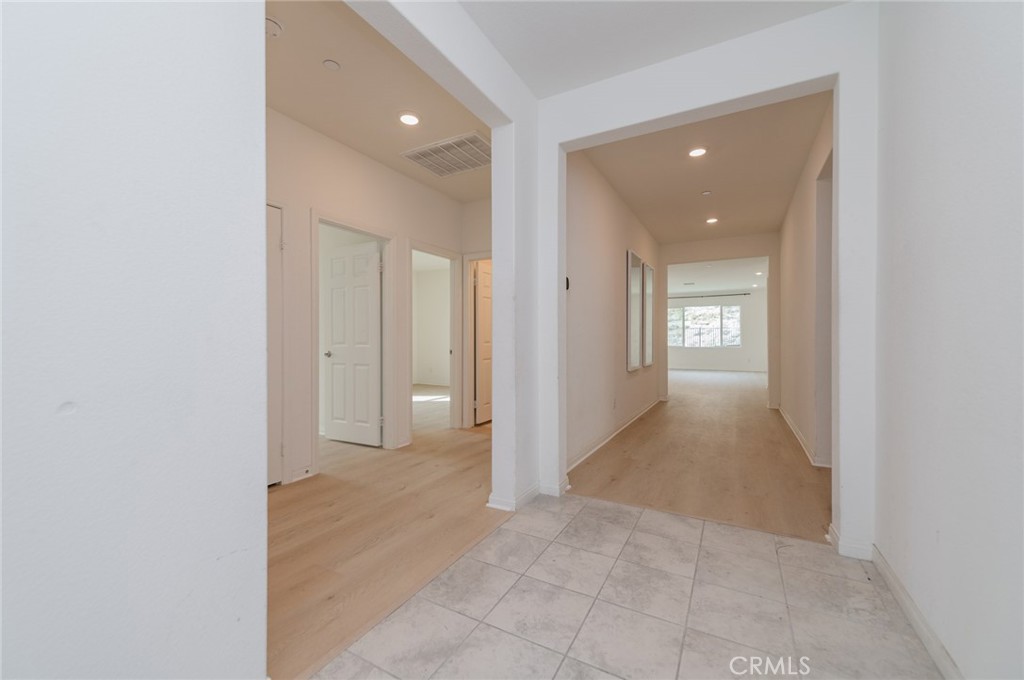 7309 Grazing Lane Riverside, CA 92507 - Photo 6 of 43 an empty room with windows and entrance