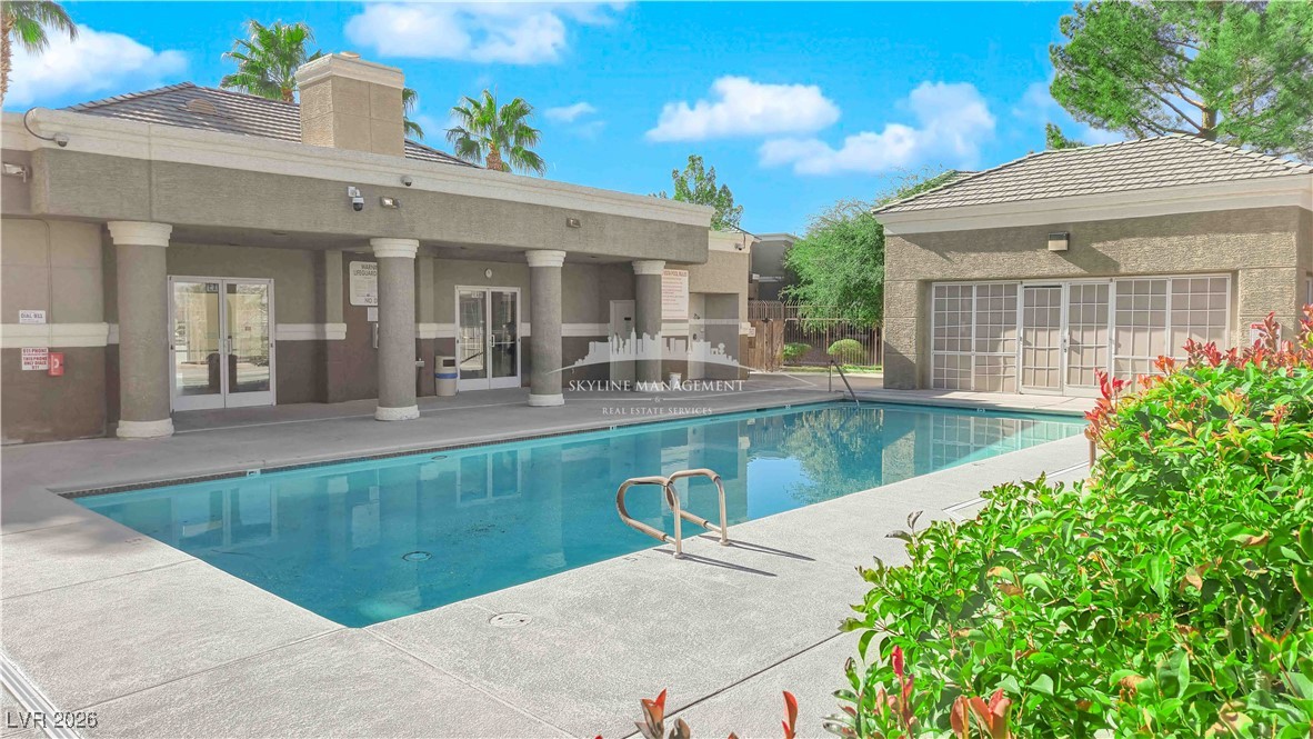 8070 West Russell Road, Unit 2063 Las Vegas, NV 89113 - Photo 29 of 31 Community pool with french doors and a patio