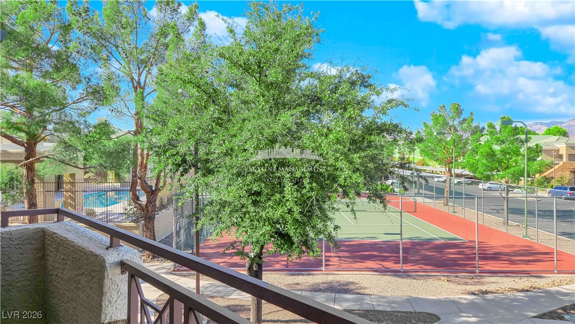 8070 West Russell Road, Unit 2063 Las Vegas, NV 89113 - Photo 30 of 31 View of tennis court with a balcony