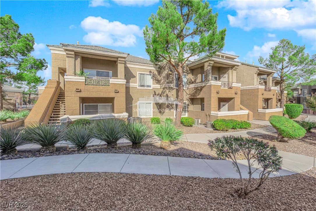 8070 West Russell Road, Unit 2063 Las Vegas, NV 89113 - Photo 4 of 31 View of property featuring stairs