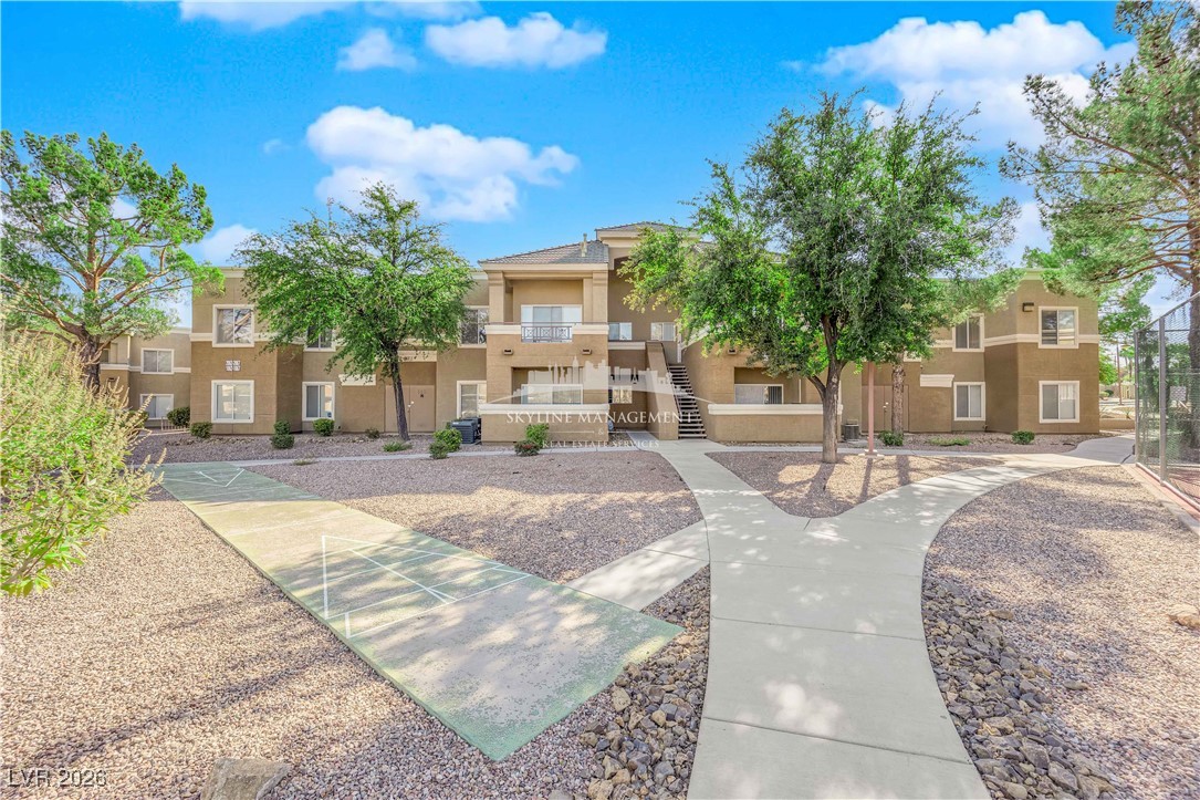 8070 West Russell Road, Unit 2063 Las Vegas, NV 89113 - Photo 5 of 31 View of property's community featuring stairway and a residential view