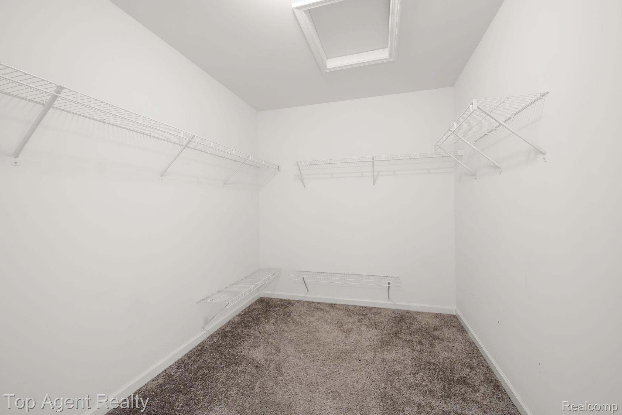 63770 Dequindre Road Washington, MI 48095 - Photo 44 of 61 Spacious closet featuring grey textured carpeting and white walls