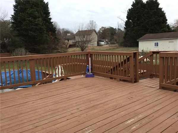 a balcony with wooden floor