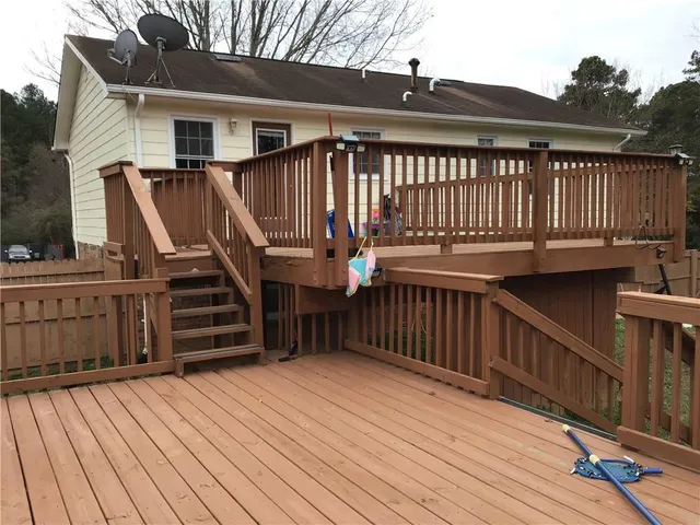 a view of deck with wooden floor and fence