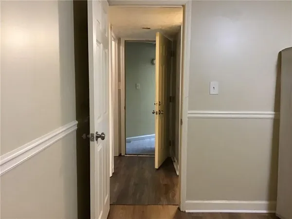 a view of a bathroom from a hallway