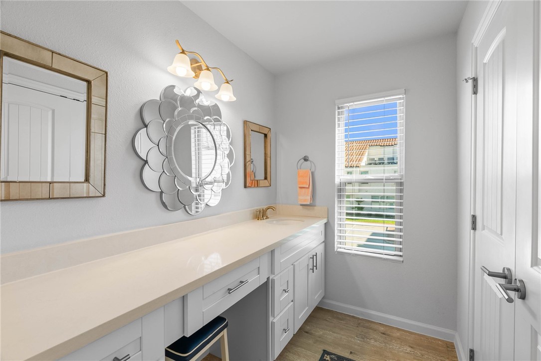 620 South Fulton Beach Road, Unit 611 Rockport, TX 78382 - Photo 13 of 15 a bathroom with a sink a vanity and a mirror