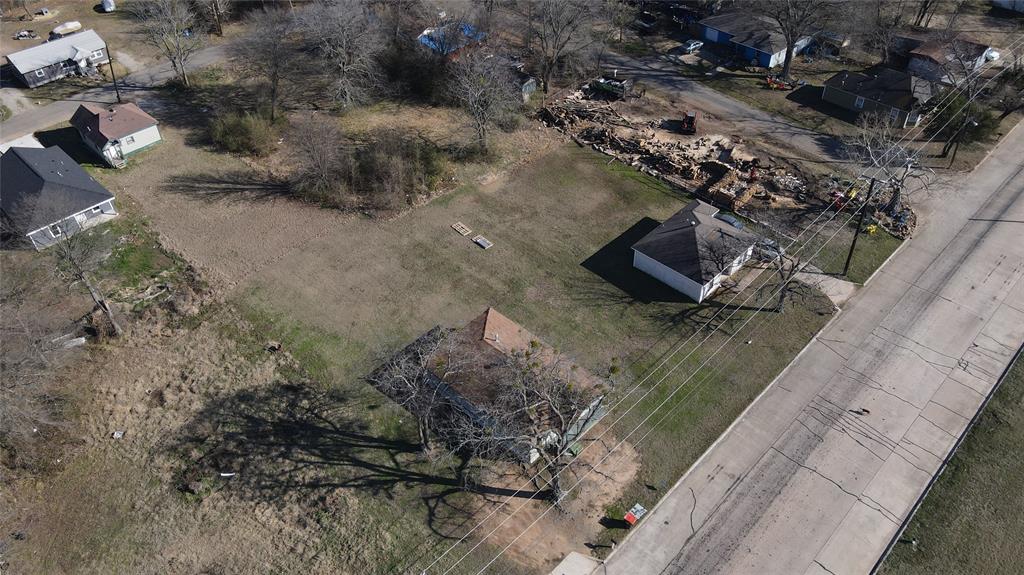 1620 Fitzhugh Avenue Paris, TX 75460 - Photo 14 of 15 a view of a street with a yard